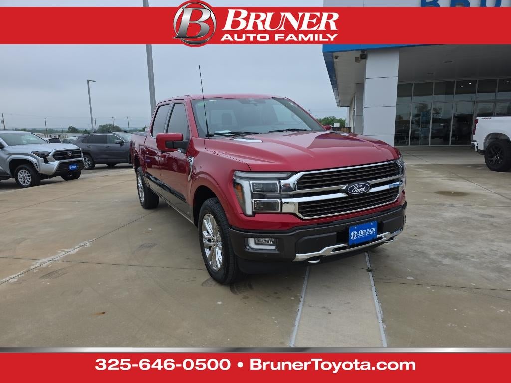 2024 Ford F-150 King Ranch in Rapid Red Metallic Tinted Clearcoat — front three-quarter view