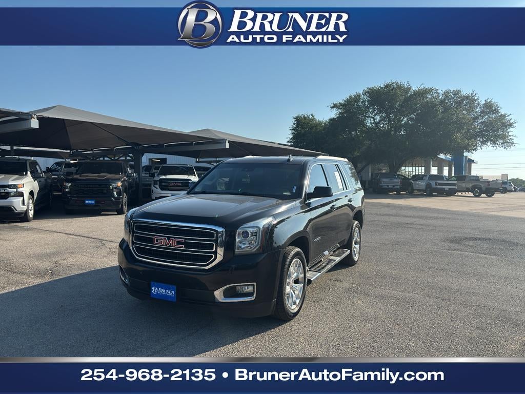 2016 GMC Yukon SLT in Onyx Black — front three-quarter view